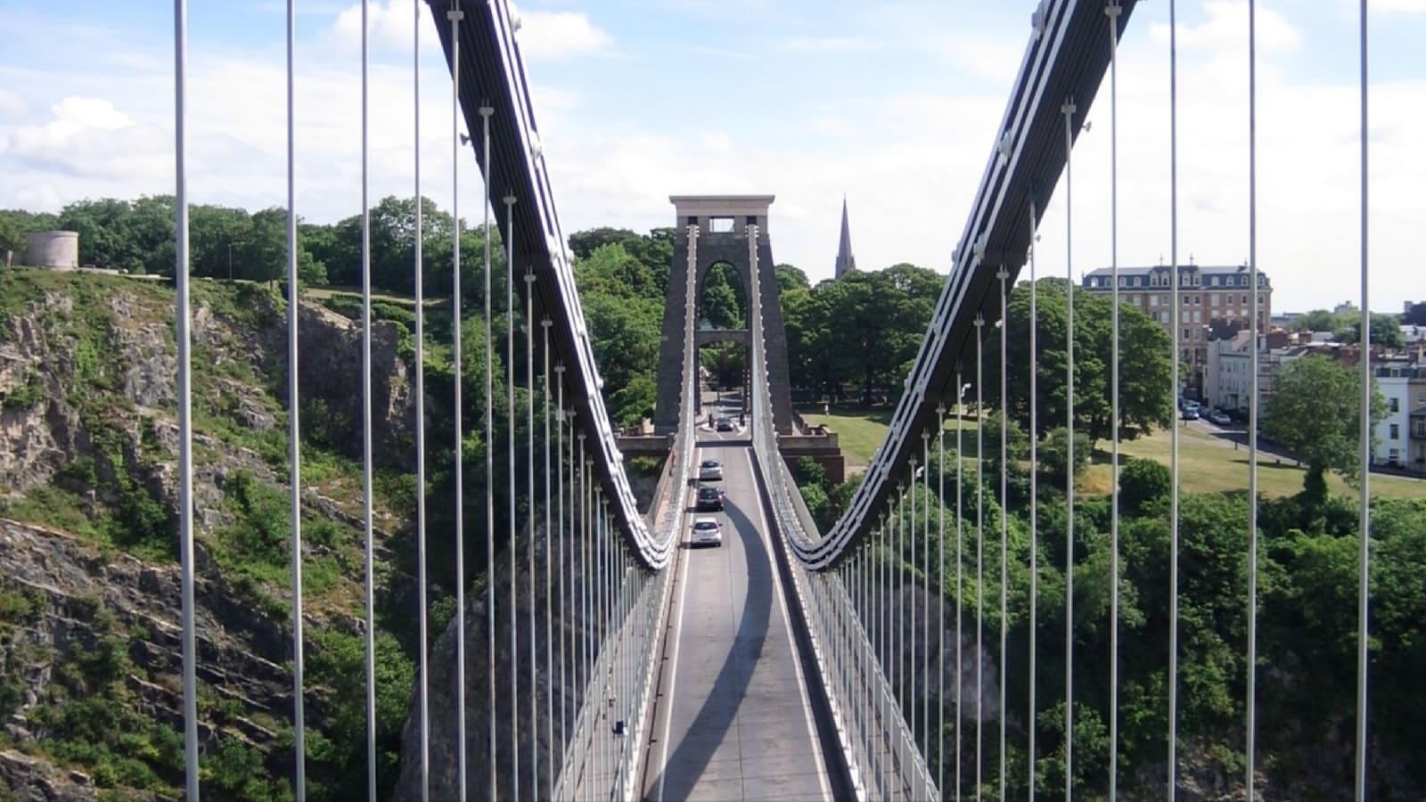 Detailed view of the stone tower and suspension chains of Clifton Suspension Bridge
